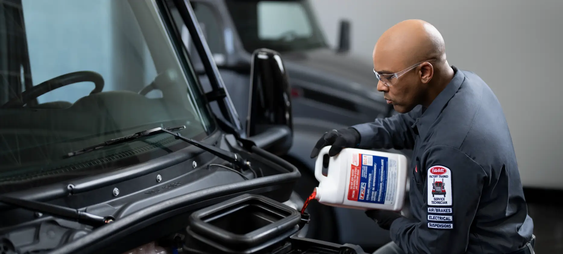 PB Service Tech Pouring Coolant Image
